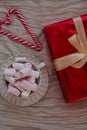 Vertical View of Heart Shaped Candy Canes with Gift Boxes and Marshmallow Mug Royalty Free Stock Photo