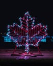 Vertical view of an illuminated maple leaf - The symbol of Canada Royalty Free Stock Photo