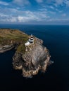 Vertical view of the lighthouse and the Old Head of Kinsale in County Cork of western Ireland