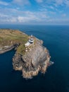 Vertical view of the lighthouse and the Old Head of Kinsale in County Cork of western Ireland Royalty Free Stock Photo