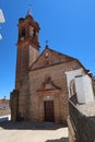 Vertical view. Main facade and bell tower of the church of the Holy Spirit of Fuenteheridos, Huelva, Spain