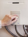 manually adjusting the temperature of the water in a gas-fired boiler Royalty Free Stock Photo