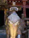 Vertical view. Monk on an elephant inside Hiranya Varna Mahavihar. golden temple Patan, Kathmandu. Nepal