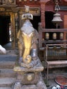 Vertical view. Monk on a gilt metal elephant inside Hiranya Varna Mahavihar. golden temple Patan, Kathmandu. Nepal