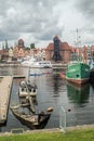 Vertical view of Old Town in Gdansk with wreck of a wooden boat