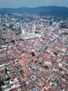 Vertical view Penang old heritage house with KOMTAR.