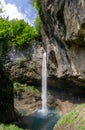 Vertical view of the picturesque and idyllic Berglistuber waterfall in the Swiss Alps near Glarus and Klausenpass