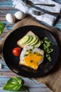 Vertical view of poached eggs with bacon and vegetables Royalty Free Stock Photo