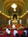 Vertical view. Public witnessing the initiation ceremony of a Buddhist monk at Wat Ratchabophit temple in Bangkok