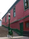 Vertical view of a red and green house in Barranco