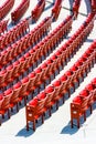 Vertical view of red plastic seats in rows