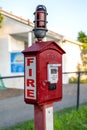 Vertical view of a red and white callbox, also know as a fire alarm box or fire alarm pull