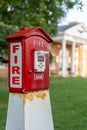 Vertical view of a red and white callbox, also know as a fire alarm box or fire alarm pull