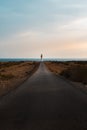Lonely lighthouse Road Royalty Free Stock Photo