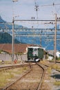 Vertical view of an SBB Ae 6 and 6 train moving through train tracks in Erstfeld, Switzerland Royalty Free Stock Photo