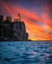 Vertical view of Split Rock lighthouse at the edge of a waterside cliff at scenic sunset Royalty Free Stock Photo