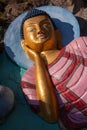 Vertical view of statue showing Sleeping lion`s posture or Reclining Buddha. Royalty Free Stock Photo