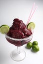 Vertical view of a strawberry smoothie with limes isolated white background Royalty Free Stock Photo