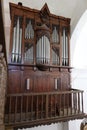 Vertical view of the 18th century pipe organ of the Santiago el Mayor church in Castano del Robledo, Huelva, Spain Royalty Free Stock Photo