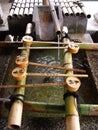 Vertical view of a typical Japanese bamboo fountain in a Kyoto temple Royalty Free Stock Photo