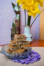 Vertical view of walnut cake pieces on the glass vase over the decorated table