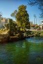 Vertical view of wheel of water mill in Medieval village L`Isle-sur-Sorgue, Vaucluse, Provence, France. Famous Sorgue river with Royalty Free Stock Photo