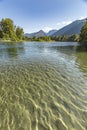 Vertical views of mountains in the background of Wenatchee River