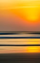 Vertical vivid orange motion blur ocean landscape abstraction