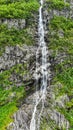 Vertical of a waterfall from high cliffs in Frafjord, Norway Royalty Free Stock Photo
