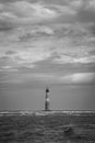 Vertical waterside grayscale shot of the Morris Island Lighthouse Royalty Free Stock Photo