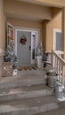 Vertical Wet stairs at home entrance leading to front door with christmas tree and wreath Royalty Free Stock Photo