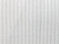 Vertical White Knitting or Knitted Fabric Texture Pattern Background