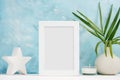 Vertical white Photo frame mock up with plants in vase, ceramic decor on shelf. Scandinavian style Royalty Free Stock Photo