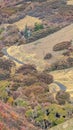 Vertical Winding road through a scenic valley in autumn Royalty Free Stock Photo