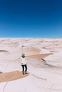 Vertical of a woman standing at Campo de Piedra Pomez, Catamarca, Argentina