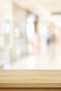 Vertical wood table background and blur background, Empty wooden counter, shelf surface over blur restaurant with bokeh background