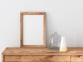 Vertical Wooden Frame poster Mockup standing on bureau Royalty Free Stock Photo