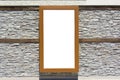 Vertical wooden poster on stone textured wall. Blank template Royalty Free Stock Photo