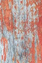 Vertical wooden surface weathered cracked red paint base grunge design background Royalty Free Stock Photo