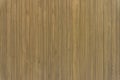 Vertical yellow-brown line wooden wall random pattern, plywood material for decortive interior in the house