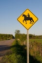 Yellow Horse Crossing Sign on a Rural Road Royalty Free Stock Photo