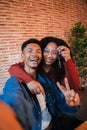 Vertical. young african american couple showing keys of their first house after purchase, moving to new home together Royalty Free Stock Photo