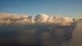 Vertically developing white and grey cumulonimbus clouds reflectin in the water of the Atlantic Ocean Royalty Free Stock Photo