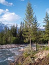 Vertically exposed scenic mountain view from the river bank in M