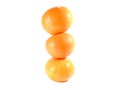 Vertically piled up three ripe oranges isolated on white background Royalty Free Stock Photo