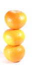 Vertically piled up three ripe oranges isolated on white background Royalty Free Stock Photo