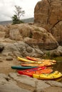 Verticals shot of the colorful kayaks on the shore at the Watson lake Royalty Free Stock Photo