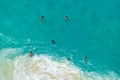 Vertiginous, swirling foamy water waves at the ocean photographed from above cliff. Royalty Free Stock Photo