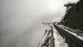 Vertiginous view of the pontoon of the sky at the peak of the Midi of the Pyrenees under the snow Royalty Free Stock Photo