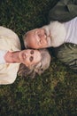 Vertival photo of rest pensioner grey hair couple wear trend shirts outside spend free time